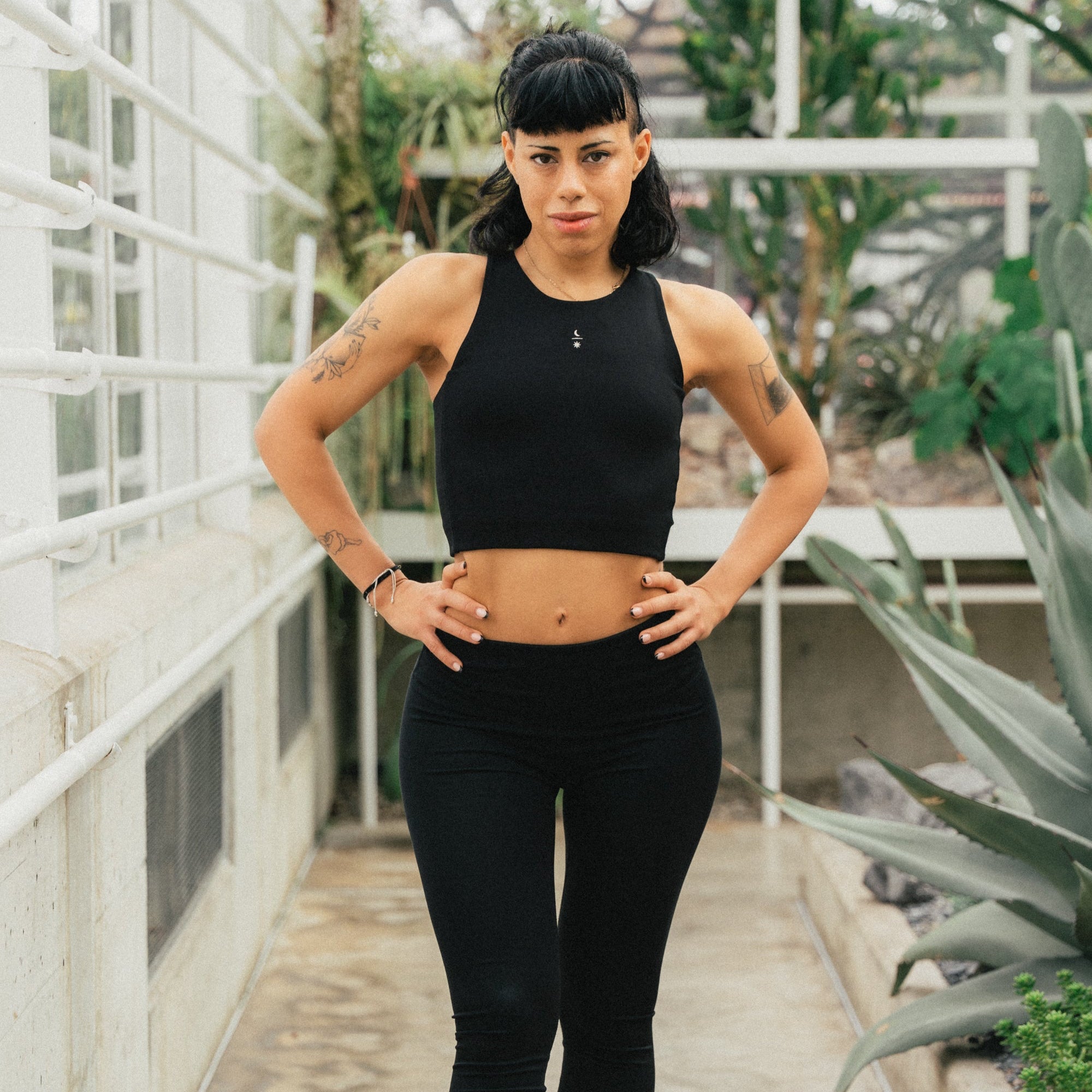 Pilates teacher wearing the Ainé sustainable luxury sports top