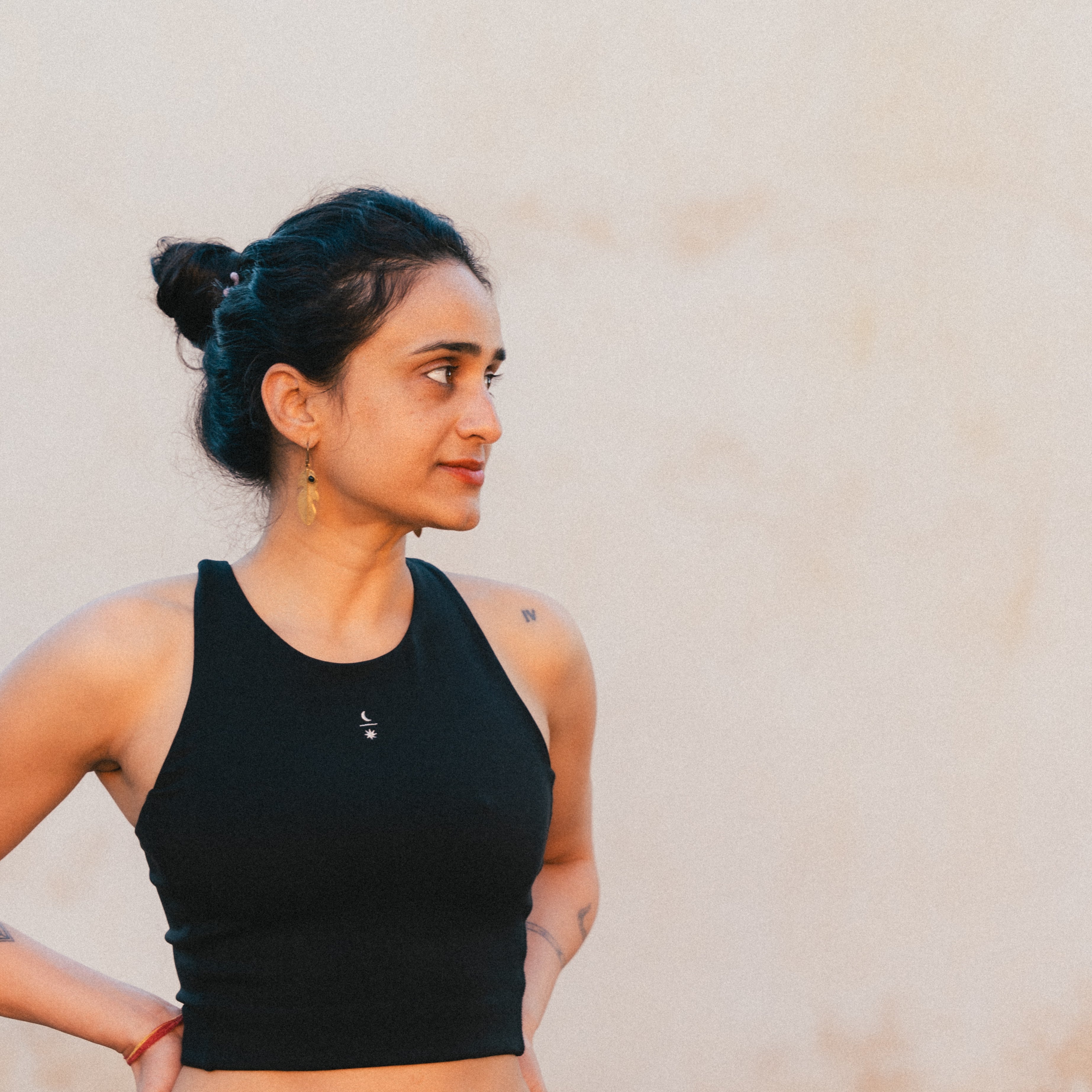 Front view of model wearing the Ainé sustainable activewear top made from Tencel