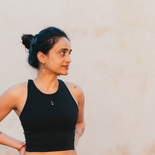 Front view of model wearing the Ainé sustainable activewear top made from Tencel